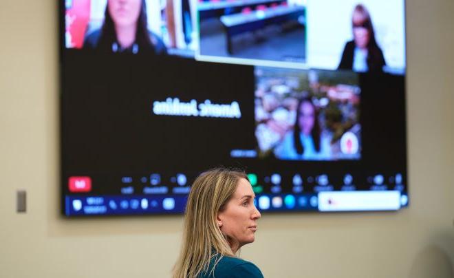 Woman in front of Zoom screen